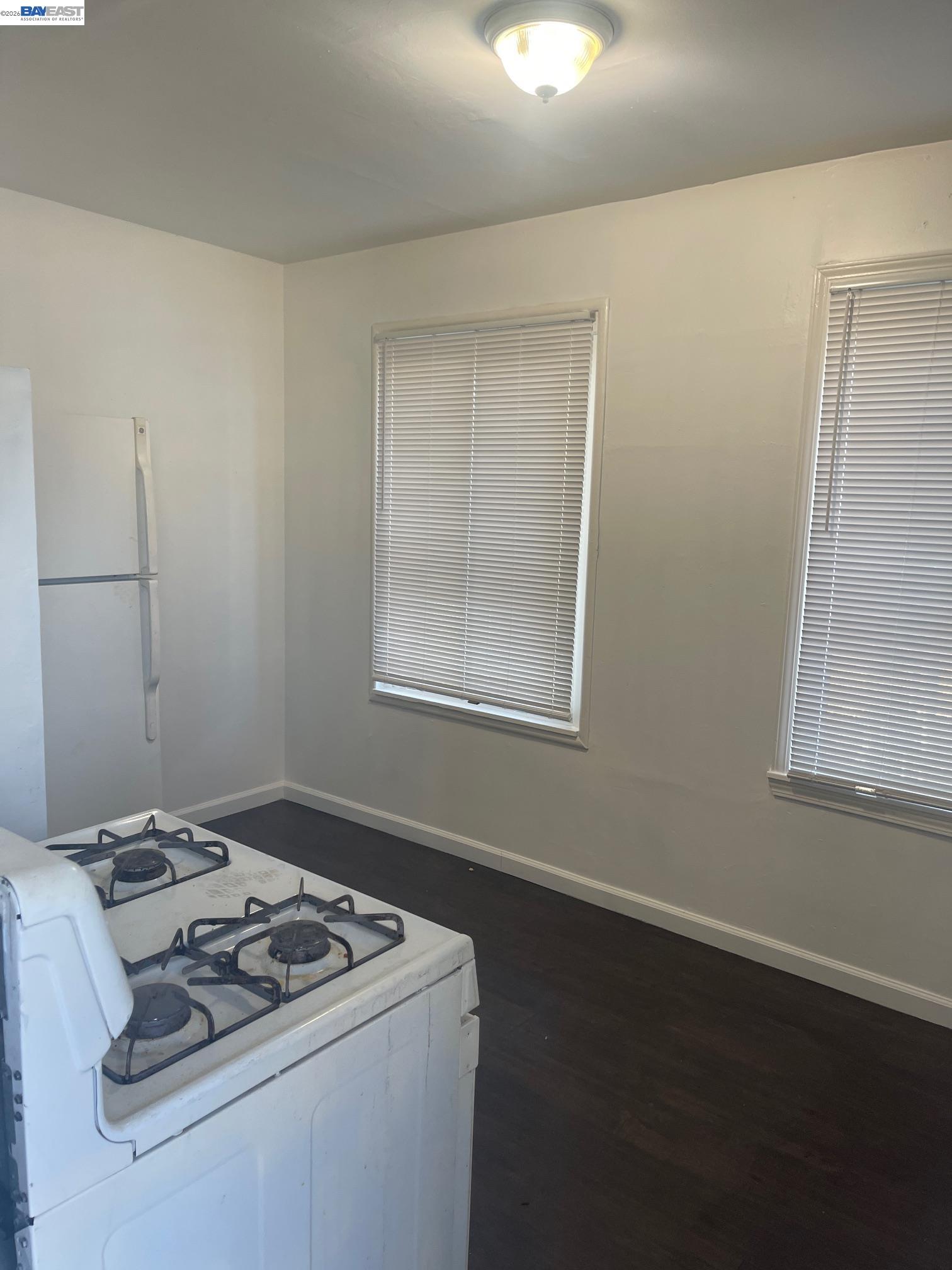 22622 2nd Street Hayward, CA 94541 - Photo 5 of 36 a white stove top oven sitting inside of a house