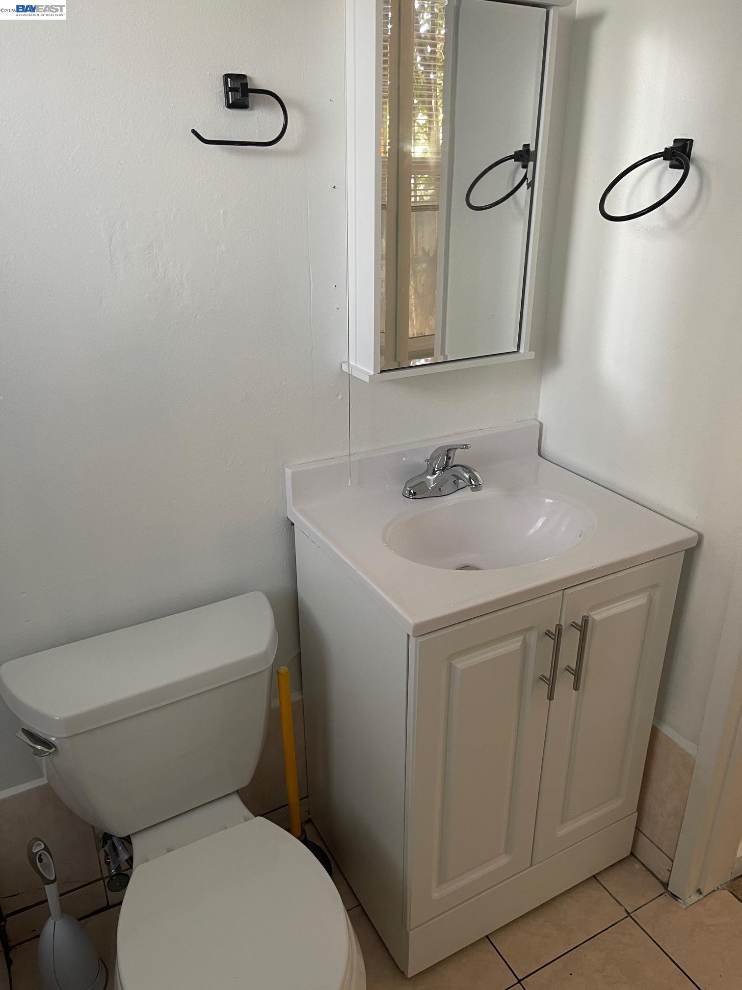 22622 2nd Street Hayward, CA 94541 - Photo 9 of 36 a bathroom with a toilet sink and mirror