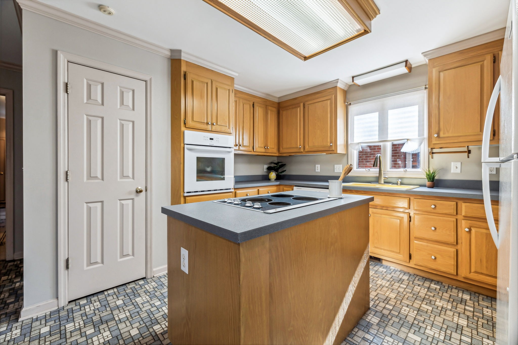 700 3rd Avenue West Springfield, TN 37172 - Photo 18 of 55 a kitchen with stainless steel appliances granite countertop a stove a sink and a refrigerator