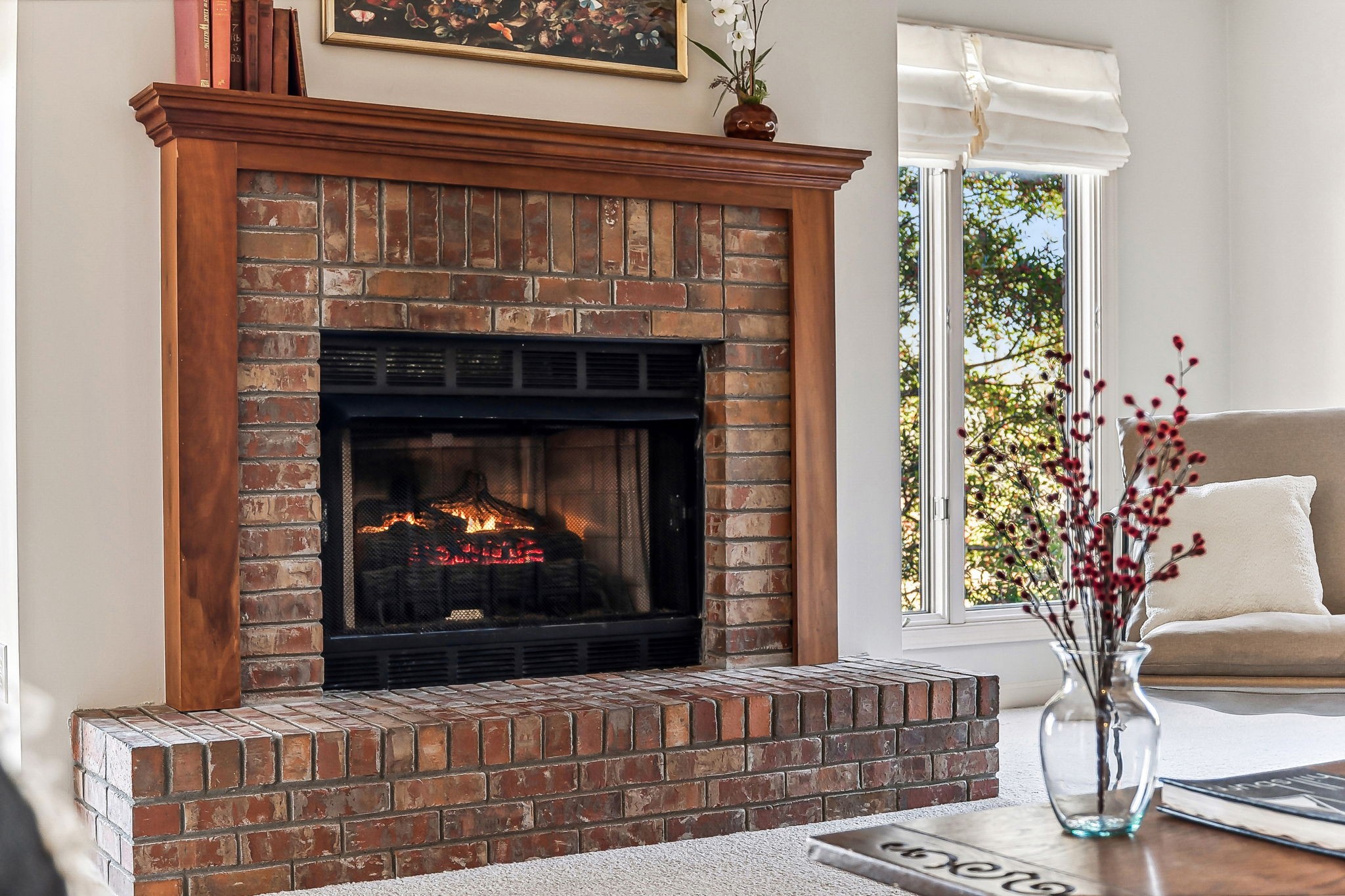 700 3rd Avenue West Springfield, TN 37172 - Photo 6 of 55 a living room with a fireplace and a potted plant