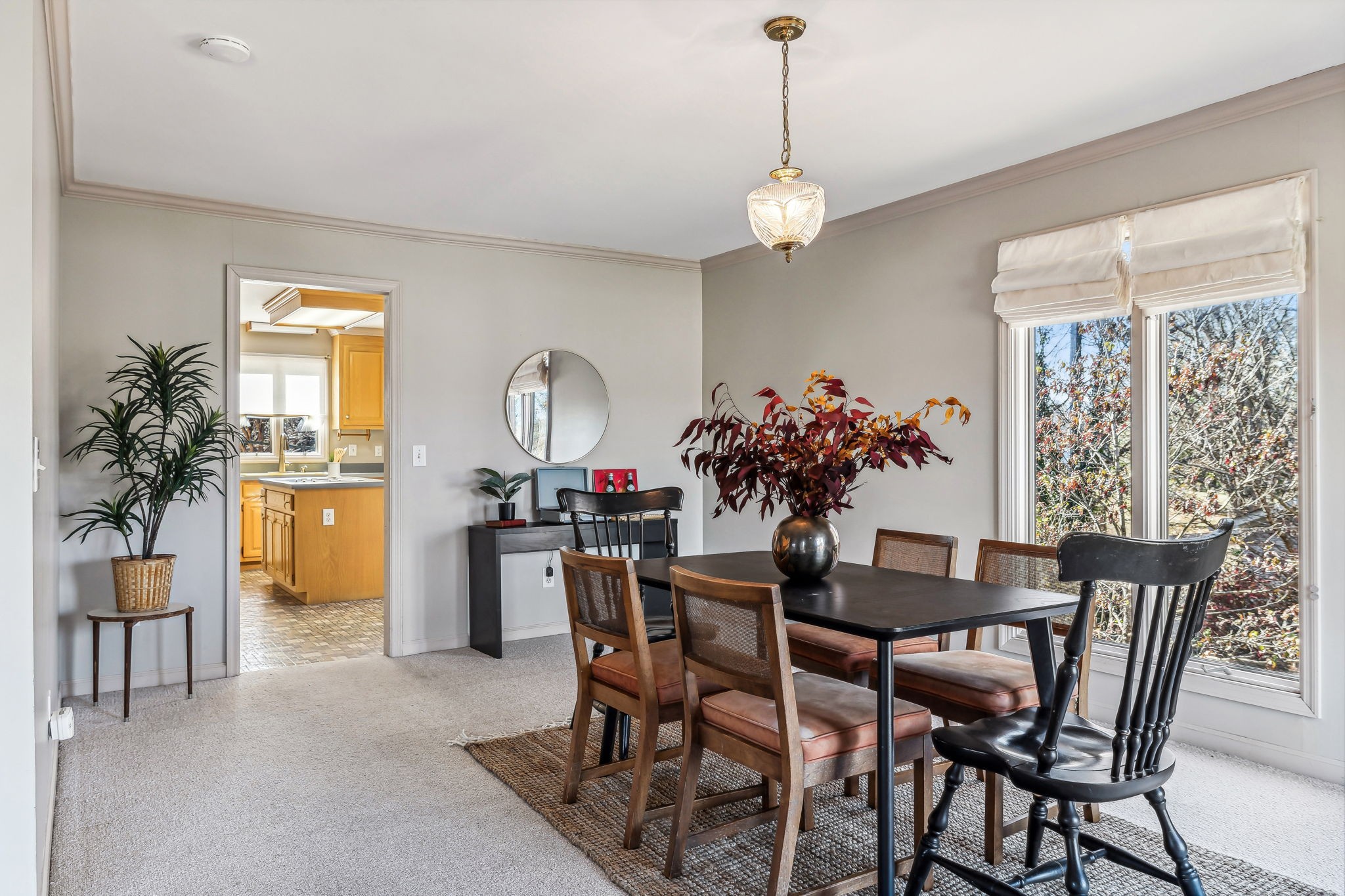 700 3rd Avenue West Springfield, TN 37172 - Photo 10 of 55 a view of a dining room with furniture and chandelier