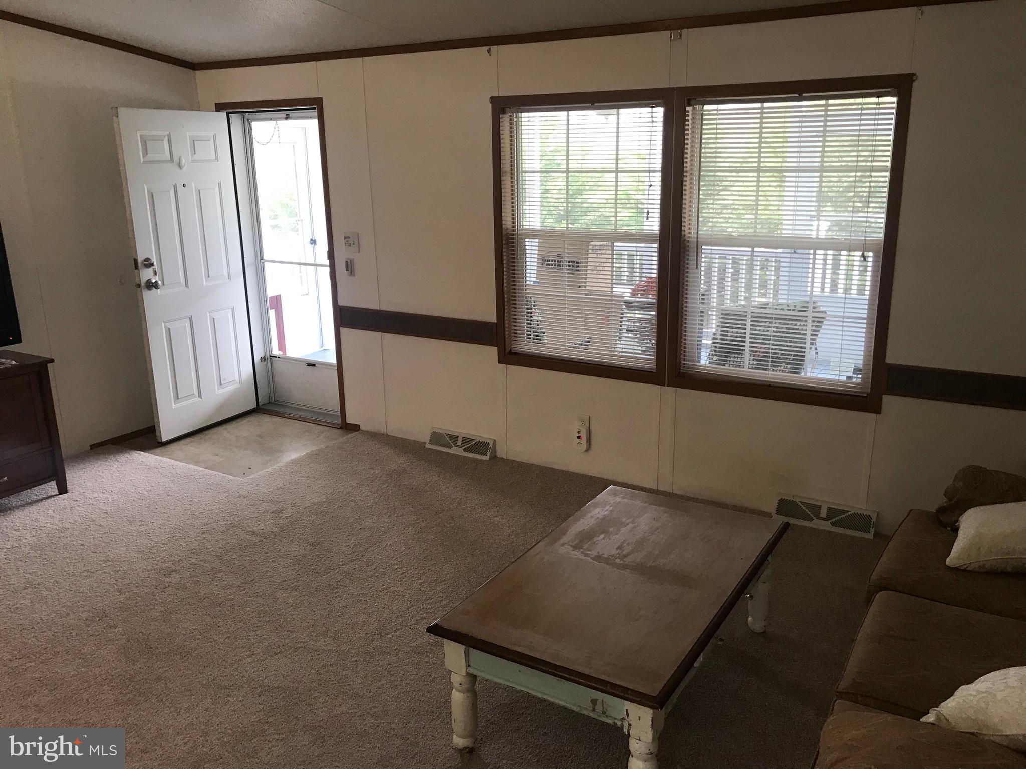 4140 Conowingo Road, Unit 1 Darlington, MD 21034 - Photo 8 of 26 Living room with view to covered porch