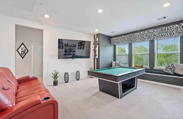 a room with furniture and a large window