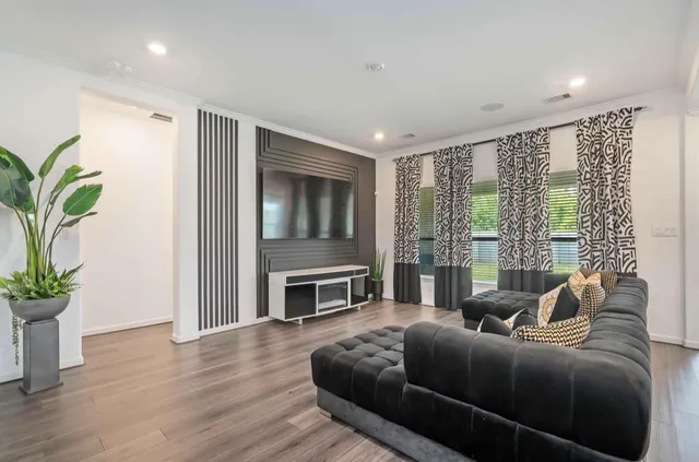 a living room with furniture windows and a fireplace