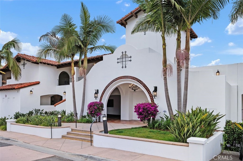 a front view of multiple houses with yard
