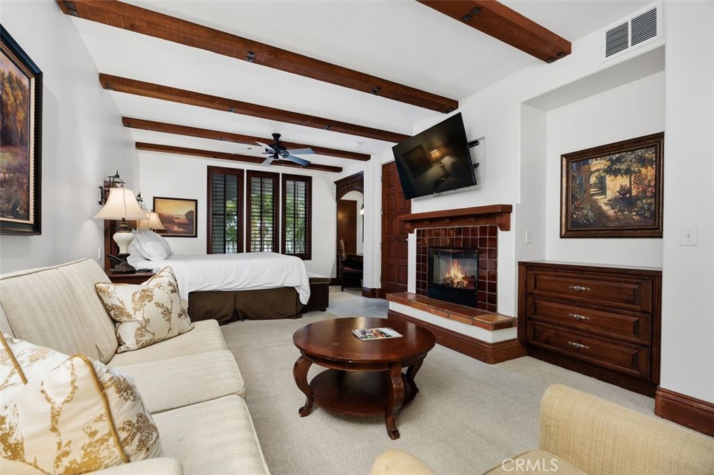7323 Estrella De Mar Road, Unit 41 Carlsbad, CA 92009 - Photo 11 of 34 a living room with furniture and a fireplace