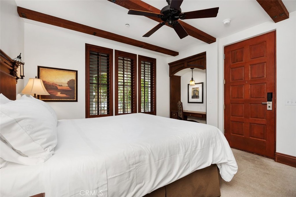 7323 Estrella De Mar Road, Unit 41 Carlsbad, CA 92009 - Photo 13 of 34 a bedroom with a large bed and a flat screen tv