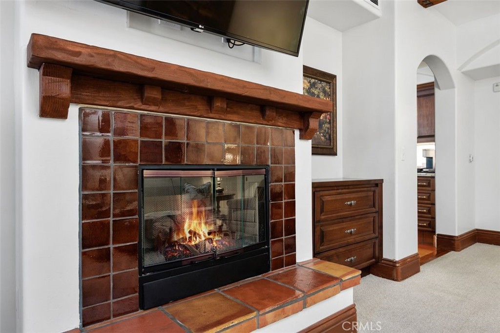 7323 Estrella De Mar Road, Unit 41 Carlsbad, CA 92009 - Photo 15 of 34 a room with furniture and a fireplace