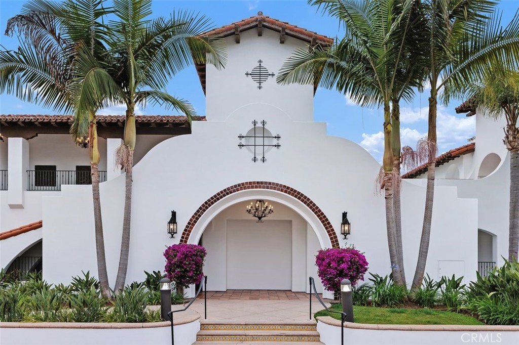 7323 Estrella De Mar Road, Unit 41 Carlsbad, CA 92009 - Photo 2 of 34 a house with palm tree in front of it