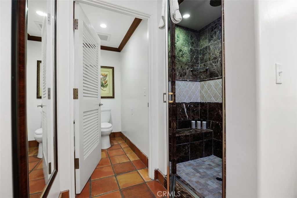 7323 Estrella De Mar Road, Unit 41 Carlsbad, CA 92009 - Photo 23 of 34 a bathroom with a sink and glass door