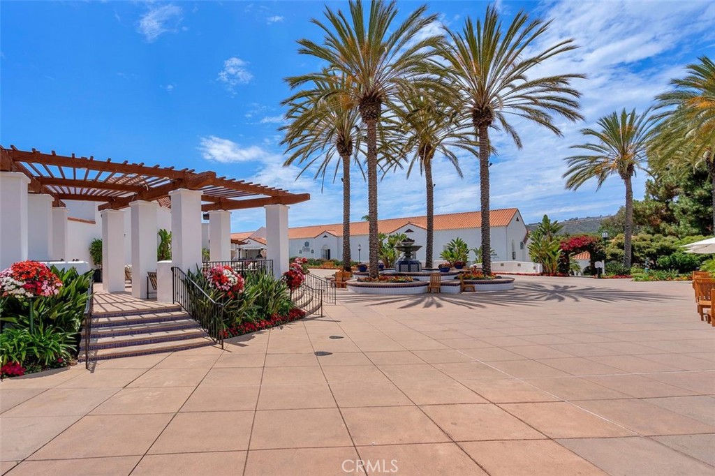 7323 Estrella De Mar Road, Unit 41 Carlsbad, CA 92009 - Photo 26 of 34 a row of palm trees in front of a house