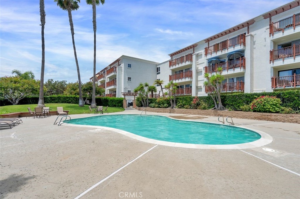 7323 Estrella De Mar Road, Unit 41 Carlsbad, CA 92009 - Photo 29 of 34 a view of a house with a swimming pool