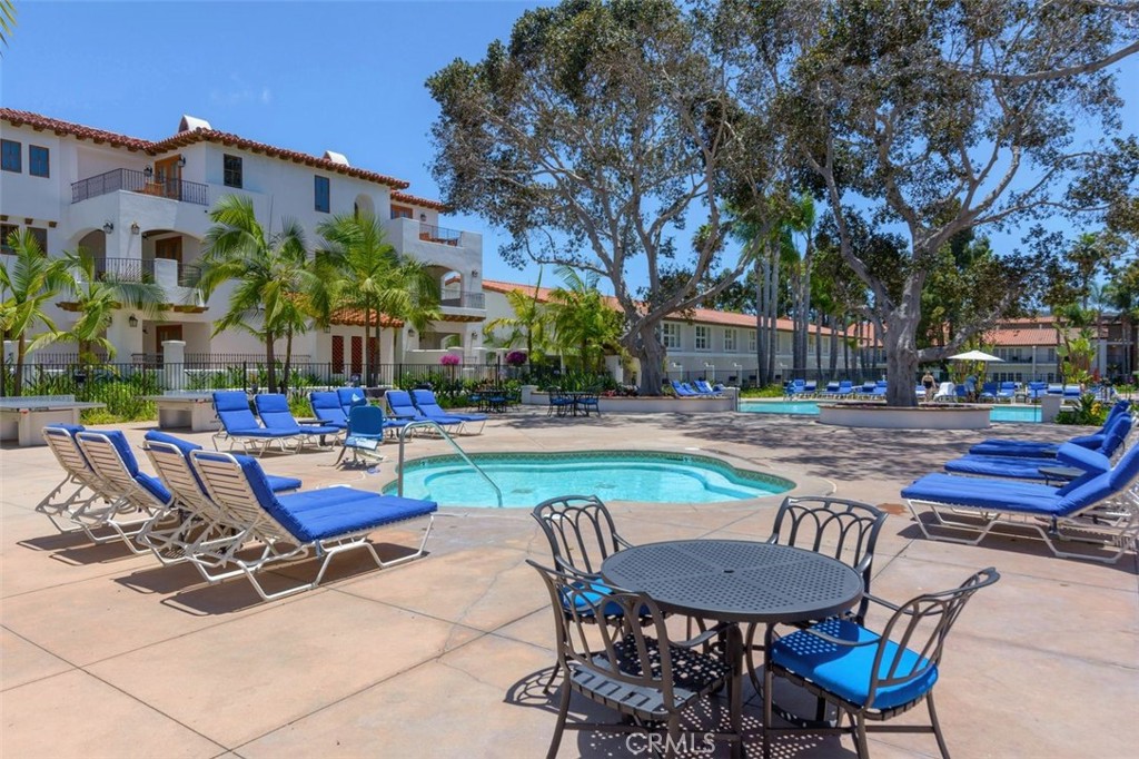 7323 Estrella De Mar Road, Unit 41 Carlsbad, CA 92009 - Photo 33 of 34 a swimming pool with outdoor seating and yard