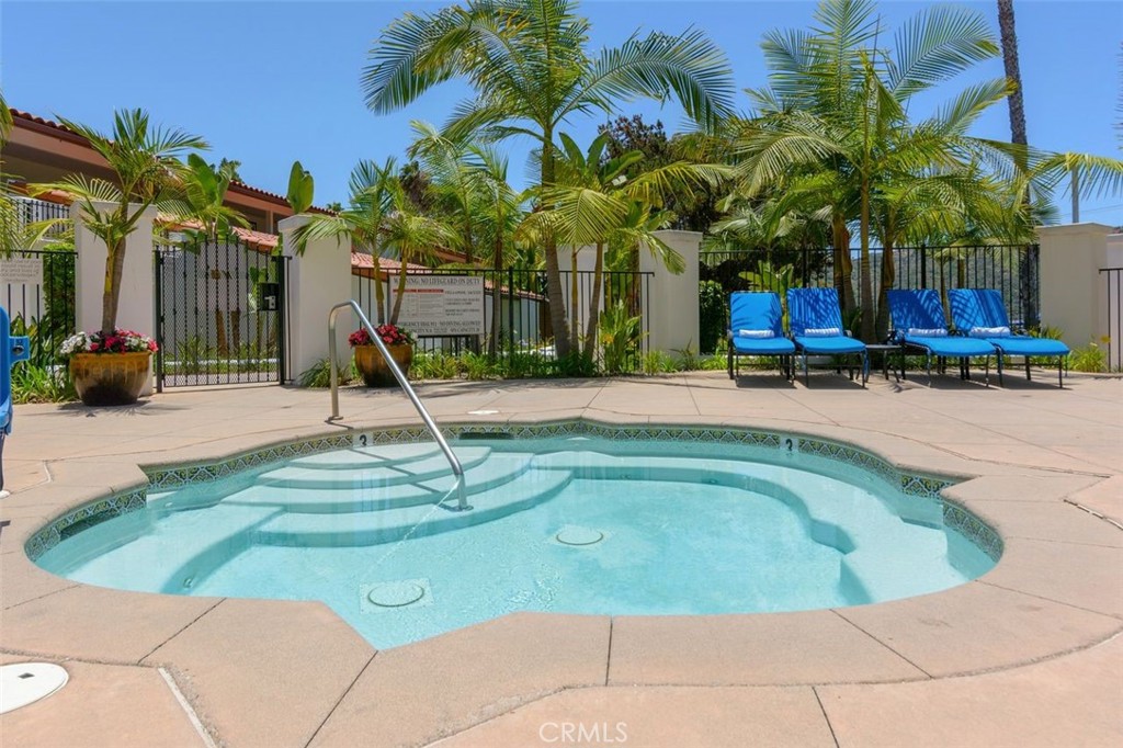 7323 Estrella De Mar Road, Unit 41 Carlsbad, CA 92009 - Photo 34 of 34 a swimming pool with outdoor seating