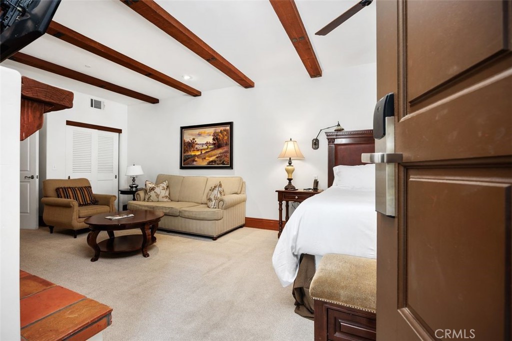 7323 Estrella De Mar Road, Unit 41 Carlsbad, CA 92009 - Photo 8 of 34 a living room with furniture and a flat screen tv