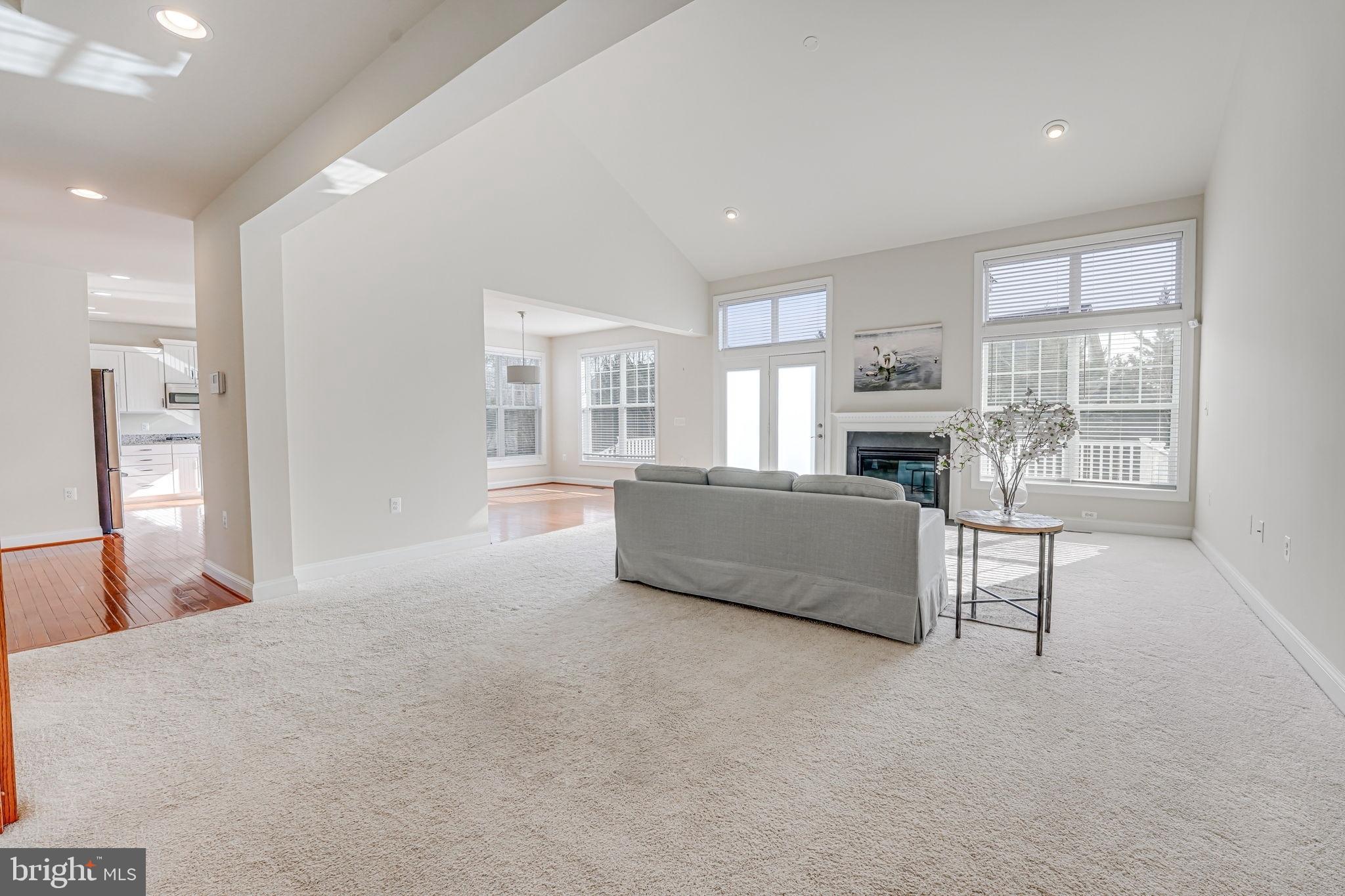11708 Eagle Ridge Drive Spotsylvania, VA 22551 - Photo 20 of 75 a living room with furniture and a kitchen