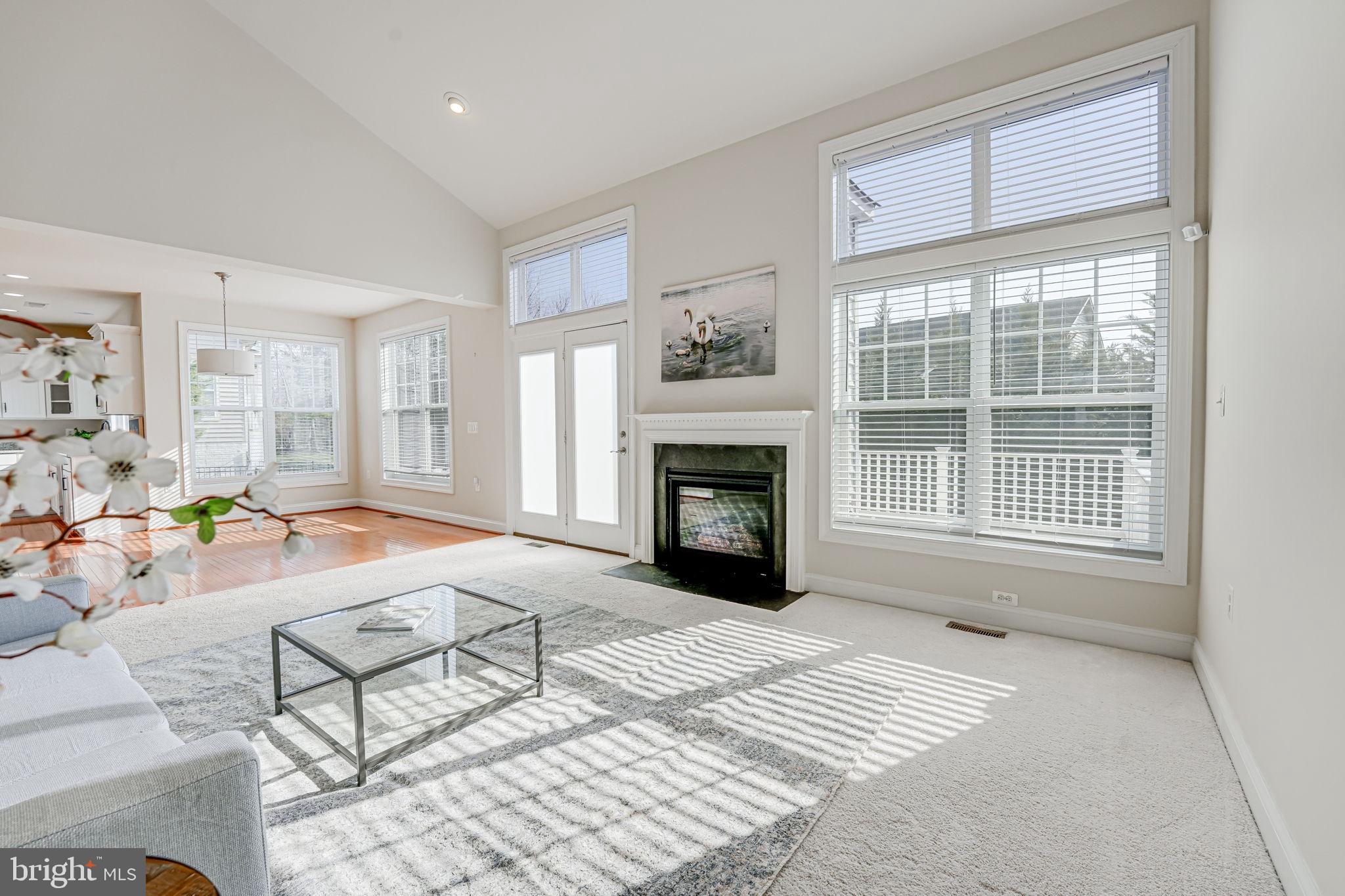 11708 Eagle Ridge Drive Spotsylvania, VA 22551 - Photo 2 of 75 a living room with furniture a window and a fireplace