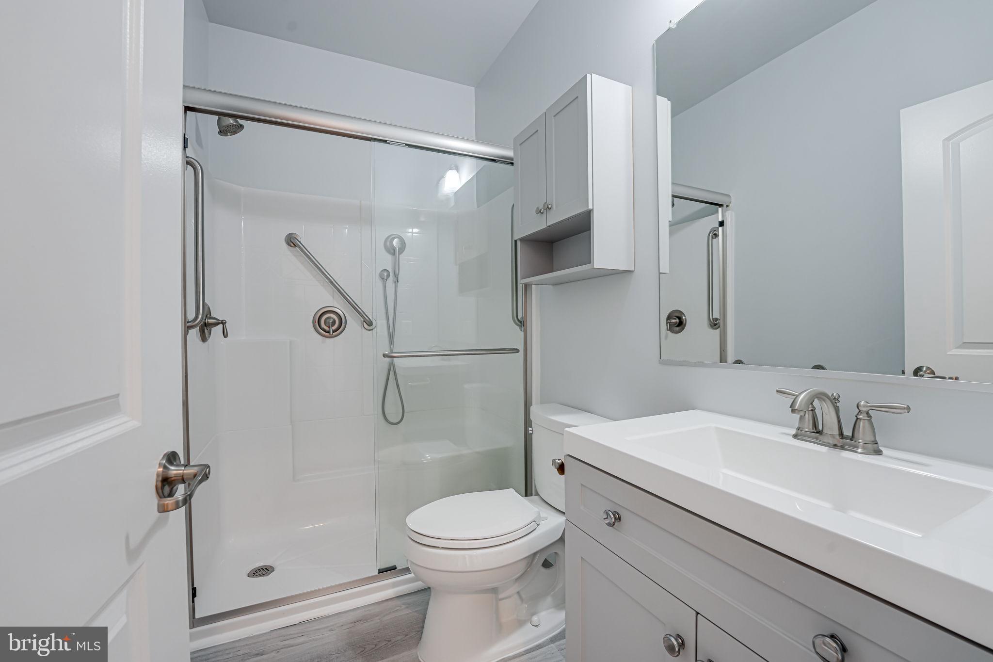 11708 Eagle Ridge Drive Spotsylvania, VA 22551 - Photo 28 of 75 a bathroom with a sink toilet and shower