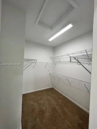 a view of a room with racks on the wall