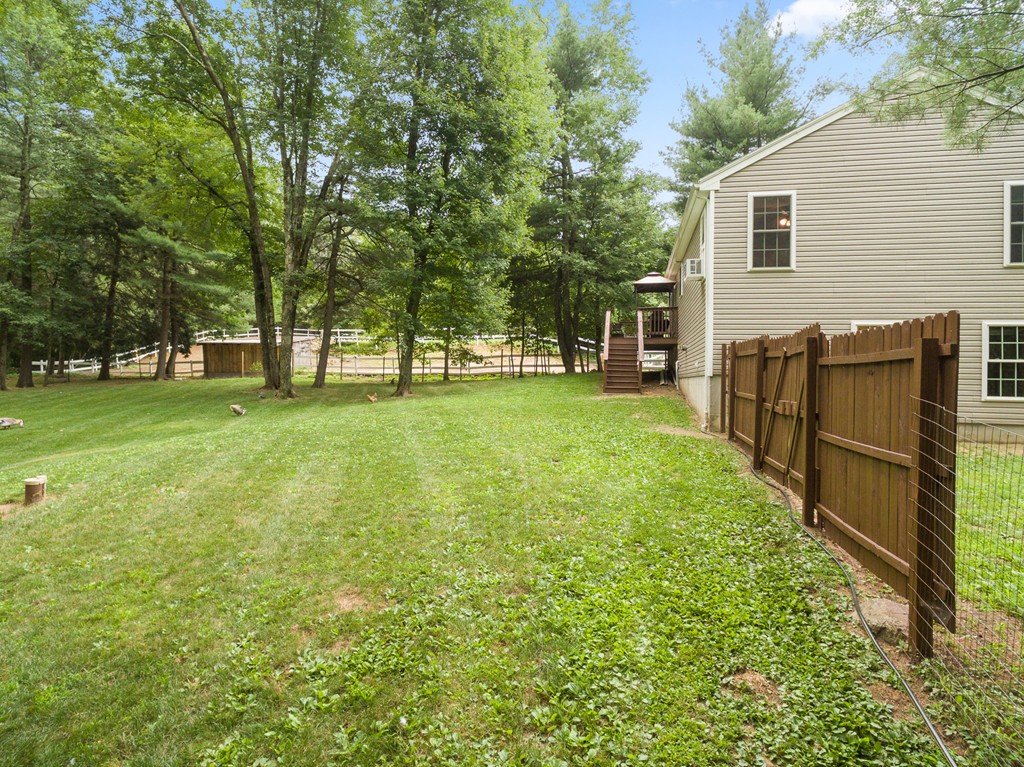 28 Mill Road North Brookfield, MA 01535 - Photo 27 of 29 a view of a backyard with large trees