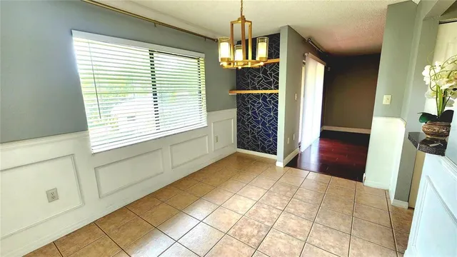 a view of entryway with window and wooden floor