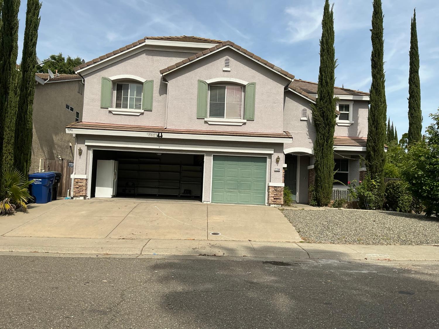 7784 Megan Ann Way Antelope, CA 95843 - Photo 1 of 20 a front view of a house with a yard and garage