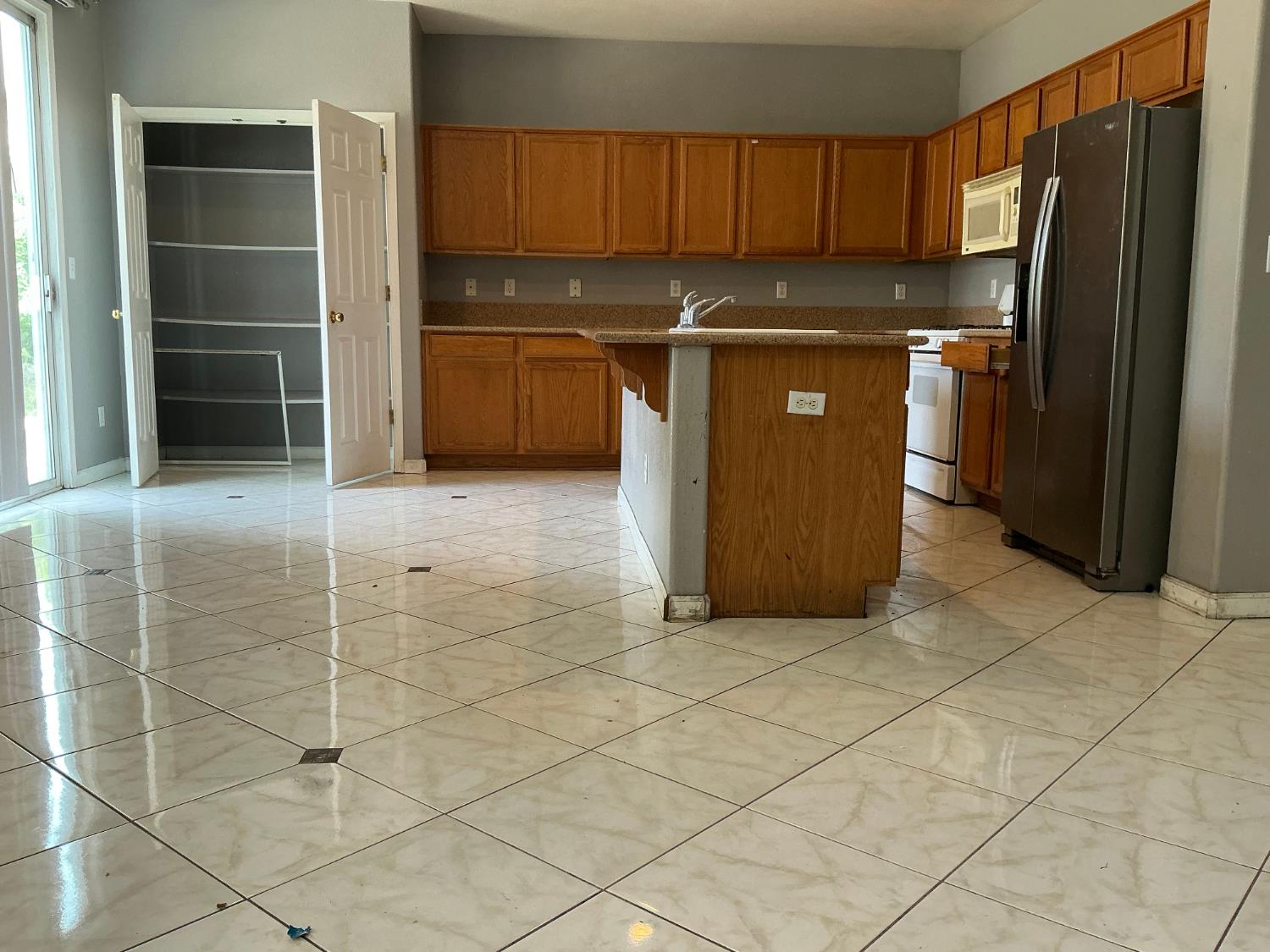 7784 Megan Ann Way Antelope, CA 95843 - Photo 5 of 20 a kitchen with stainless steel appliances granite countertop a refrigerator and a stove top oven