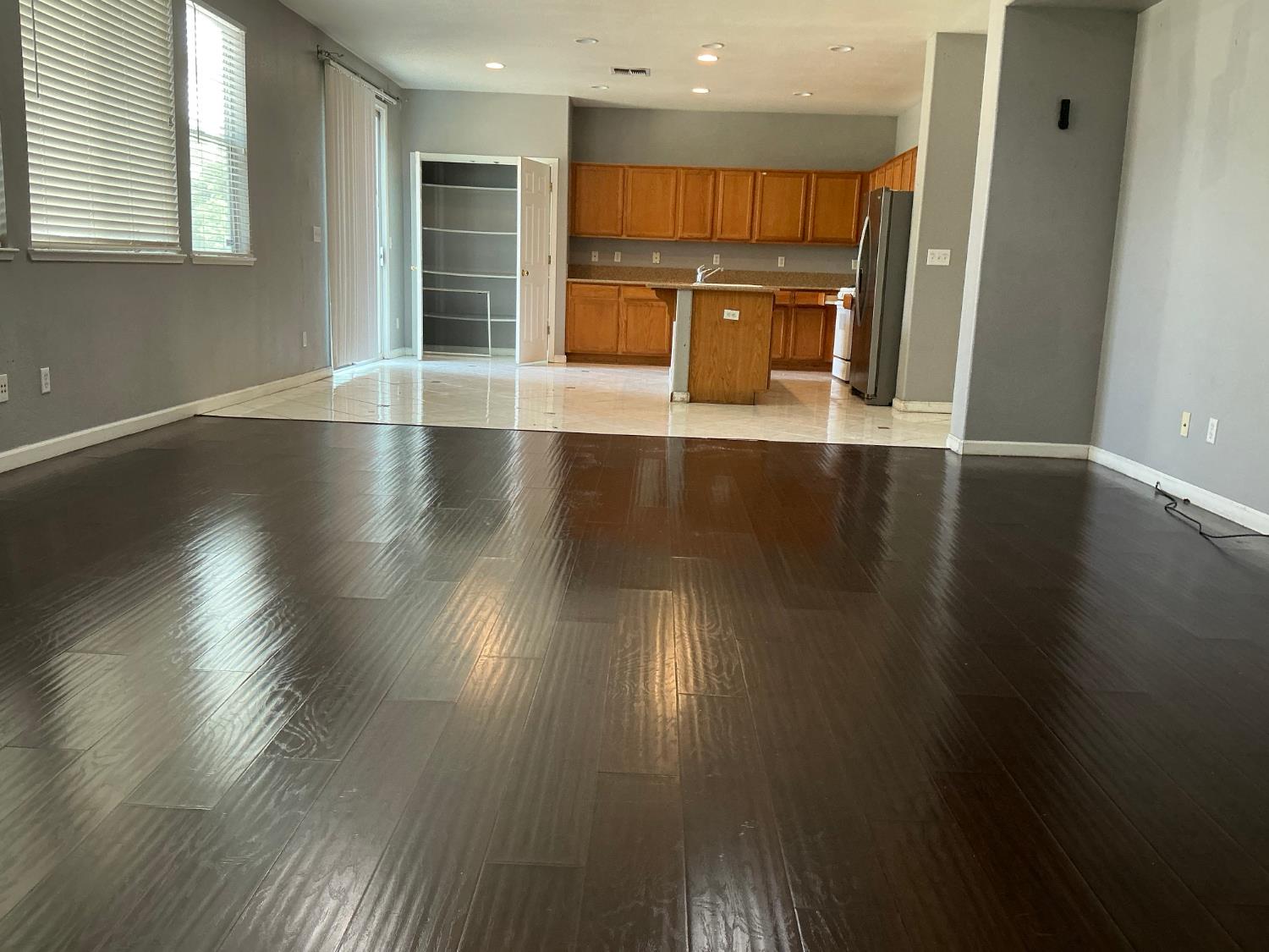 7784 Megan Ann Way Antelope, CA 95843 - Photo 7 of 20 an empty room with wooden floor and windows