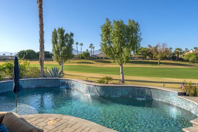 a view of a swimming pool with a patio