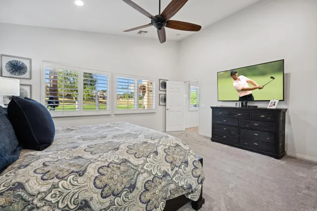 a bedroom with bed and a window