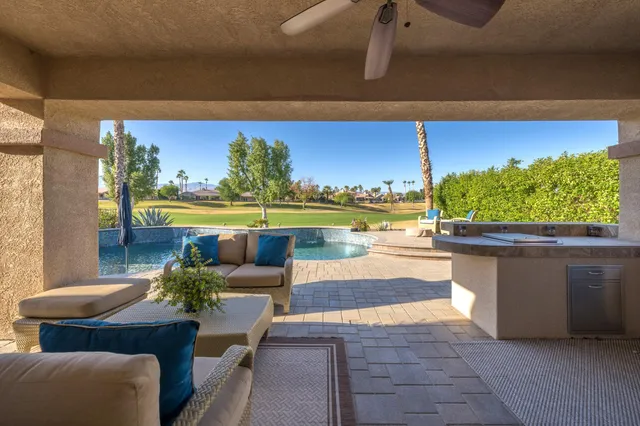a view of a balcony with chair and table