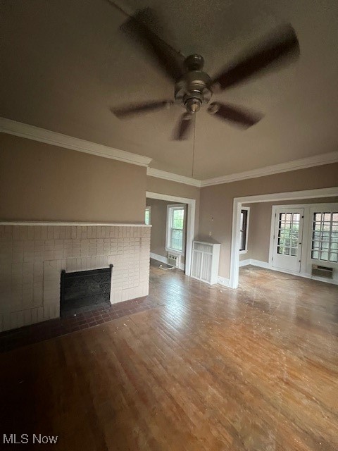 2915 Ludlow Road Cleveland, OH 44120 - Photo 31 of 50 Unfurnished living room featuring ornamental molding, a fireplace, wood finished floors, and ceiling fan