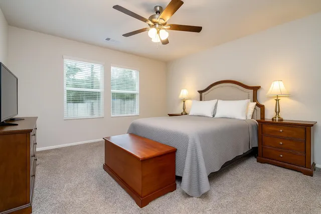 a bathroom with a shower and a glass door
