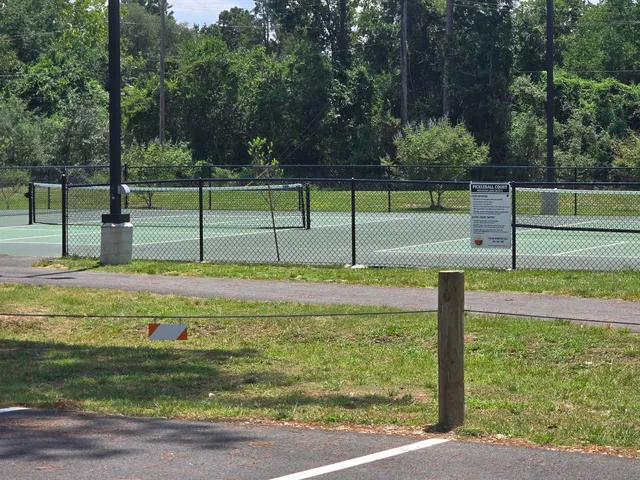 a front view of a building with garden
