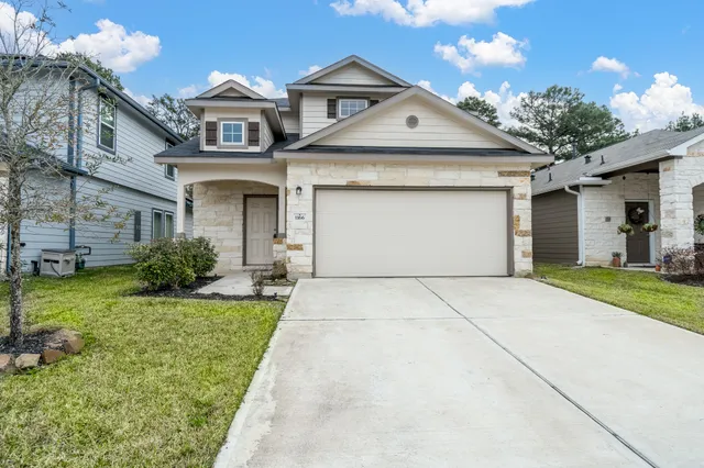 a kitchen with kitchen island granite countertop wooden cabinets and stainless steel appliances
