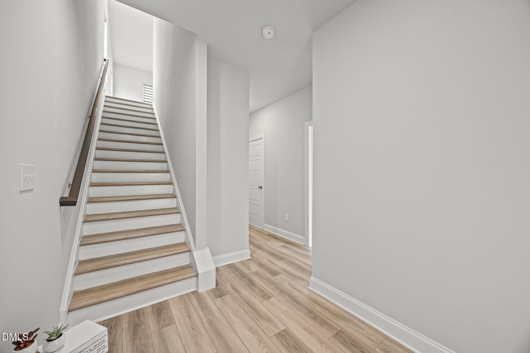 501 Hedrick Ridge Road Cary, NC 27519 - Photo 8 of 47 a view of a hallway with wooden floor and entryway
