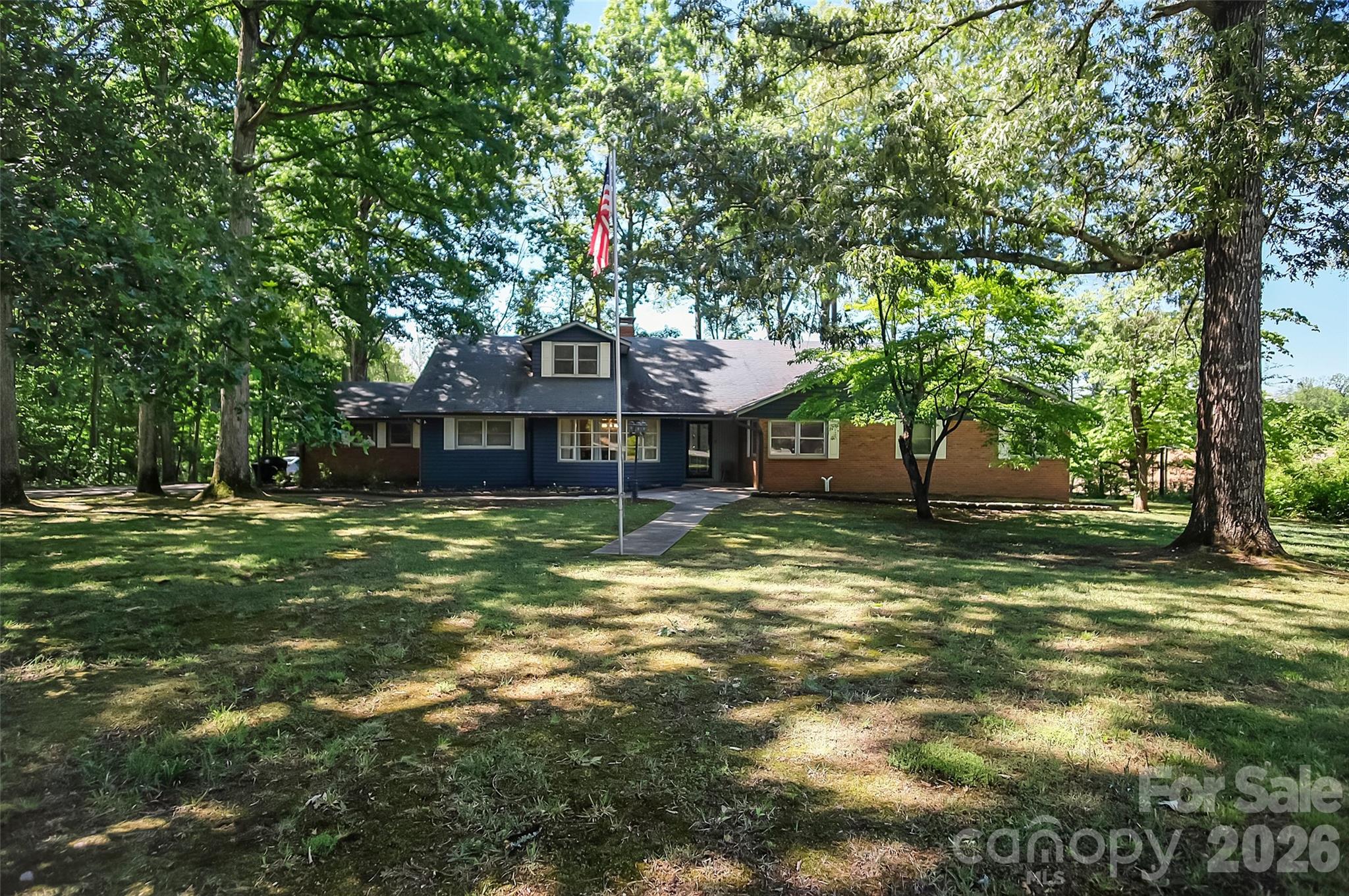808 Old Mt Holly Road Stanley, NC 28164 - Photo 1 of 48 a front view of a house with a garden