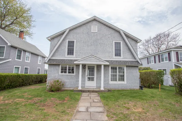 a view of a house with a yard