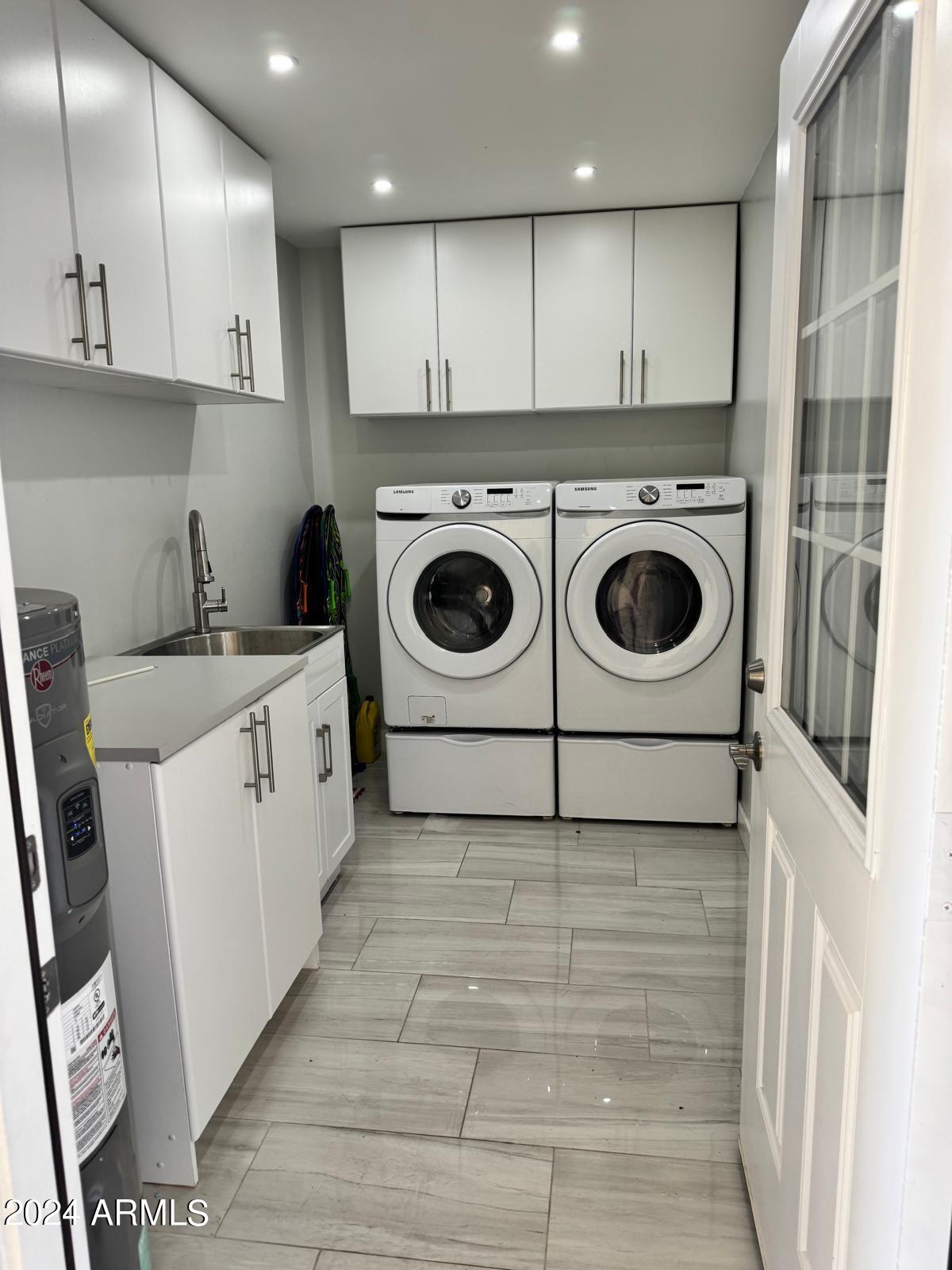 7209 West Luke Avenue Glendale, AZ 85303 - Photo 16 of 19 a utility room with dryer and washer