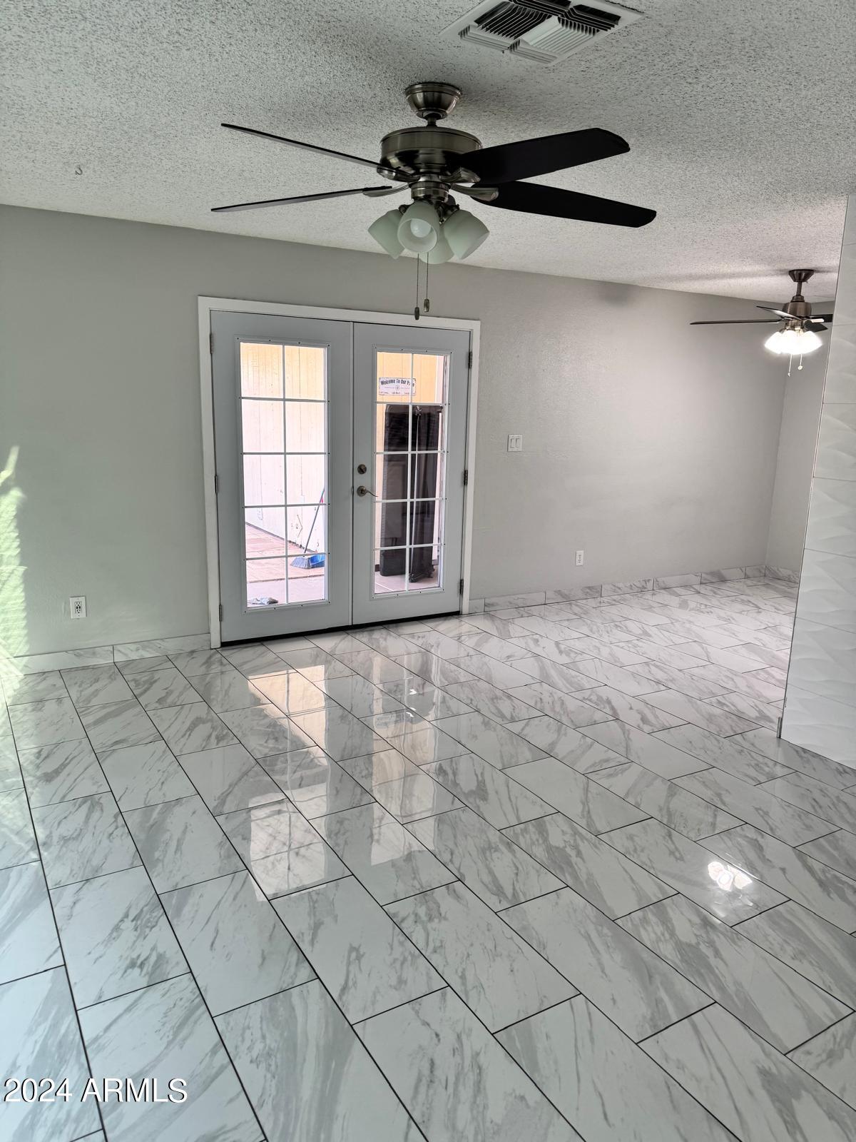 7209 West Luke Avenue Glendale, AZ 85303 - Photo 8 of 19 a view of an empty room and window