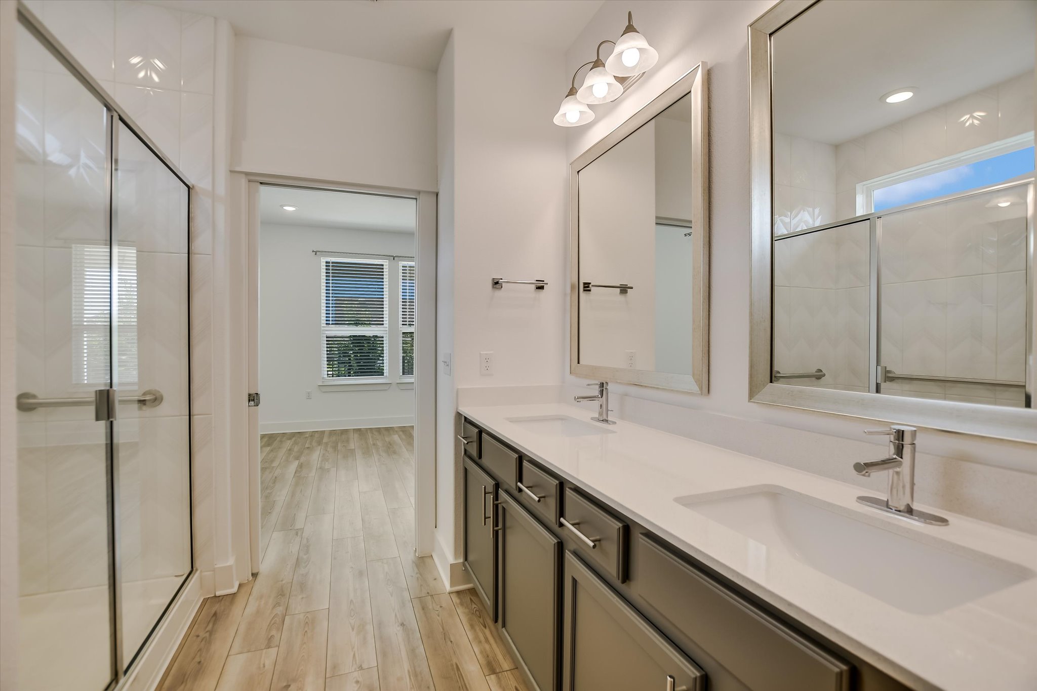 702 Kitty Hawk Road Georgetown, TX 78633 - Photo 12 of 20 a bathroom with a sink double vanity granite tub and shower
