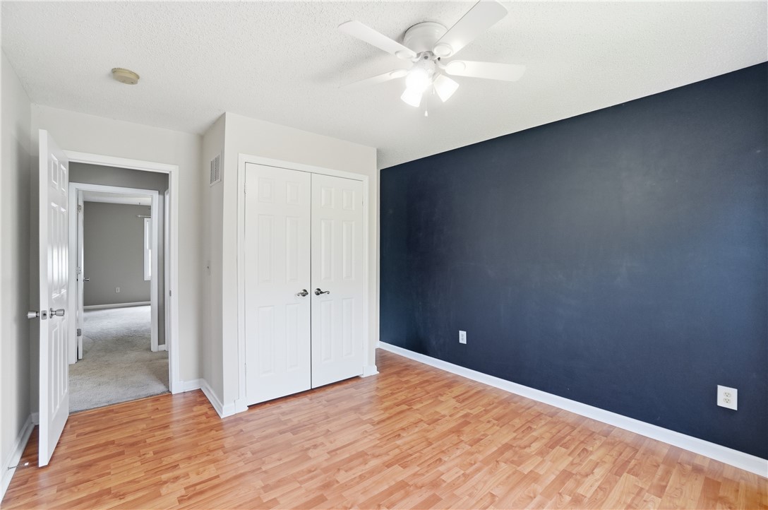 1208 Jarva Lane Springboro, OH 45066 - Photo 43 of 75 This airy bedroom features smooth laminate flooring and a bright ceiling fan, perfect for comfortable living.