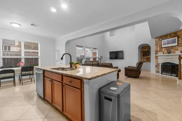 a kitchen with a stove and a sink