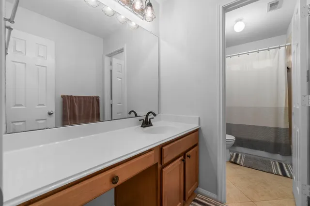 a bed room with a bed and a desk