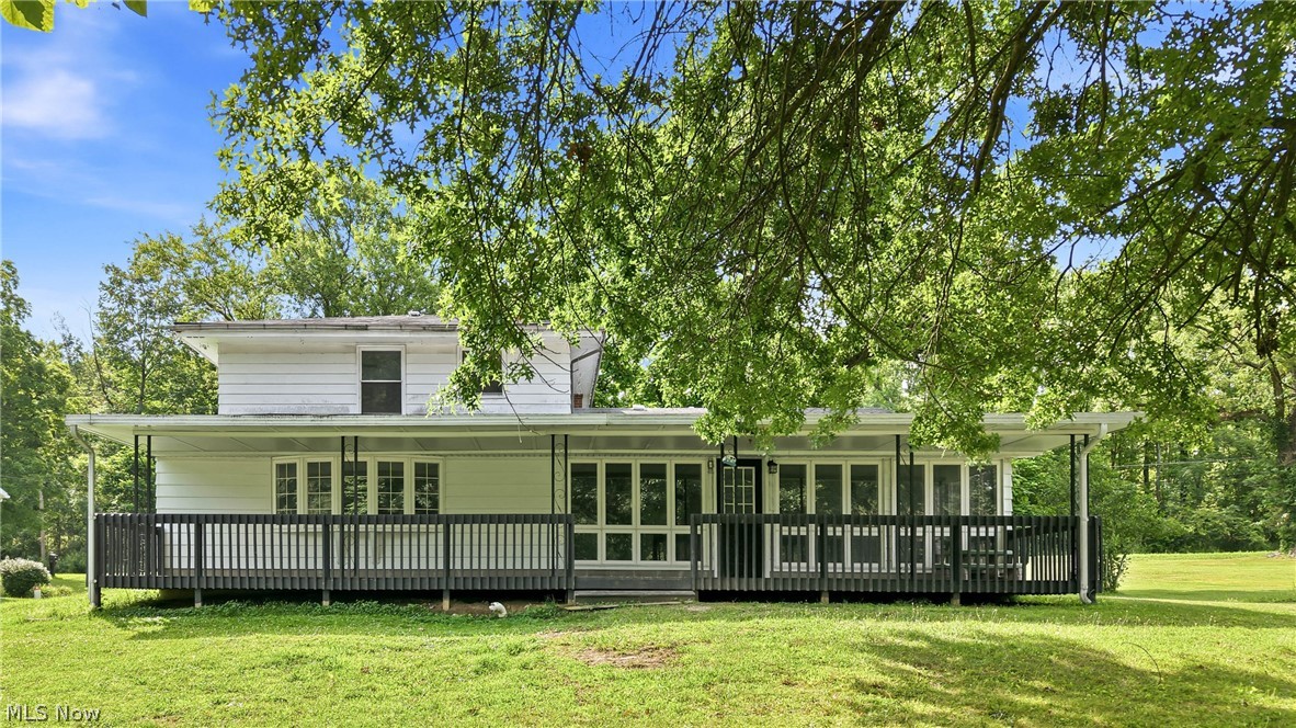 1501 Ohltown McDonald Road Mineral Ridge, OH 44440 - Photo 6 of 32 White exterior with a covered porch featuring dark railings