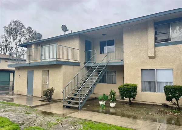 a front view of a house with garage