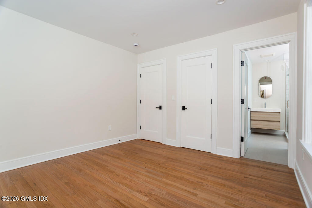 49 Salisbury Road Darien, CT 06820 - Photo 23 of 40 a view of empty room with wooden floor