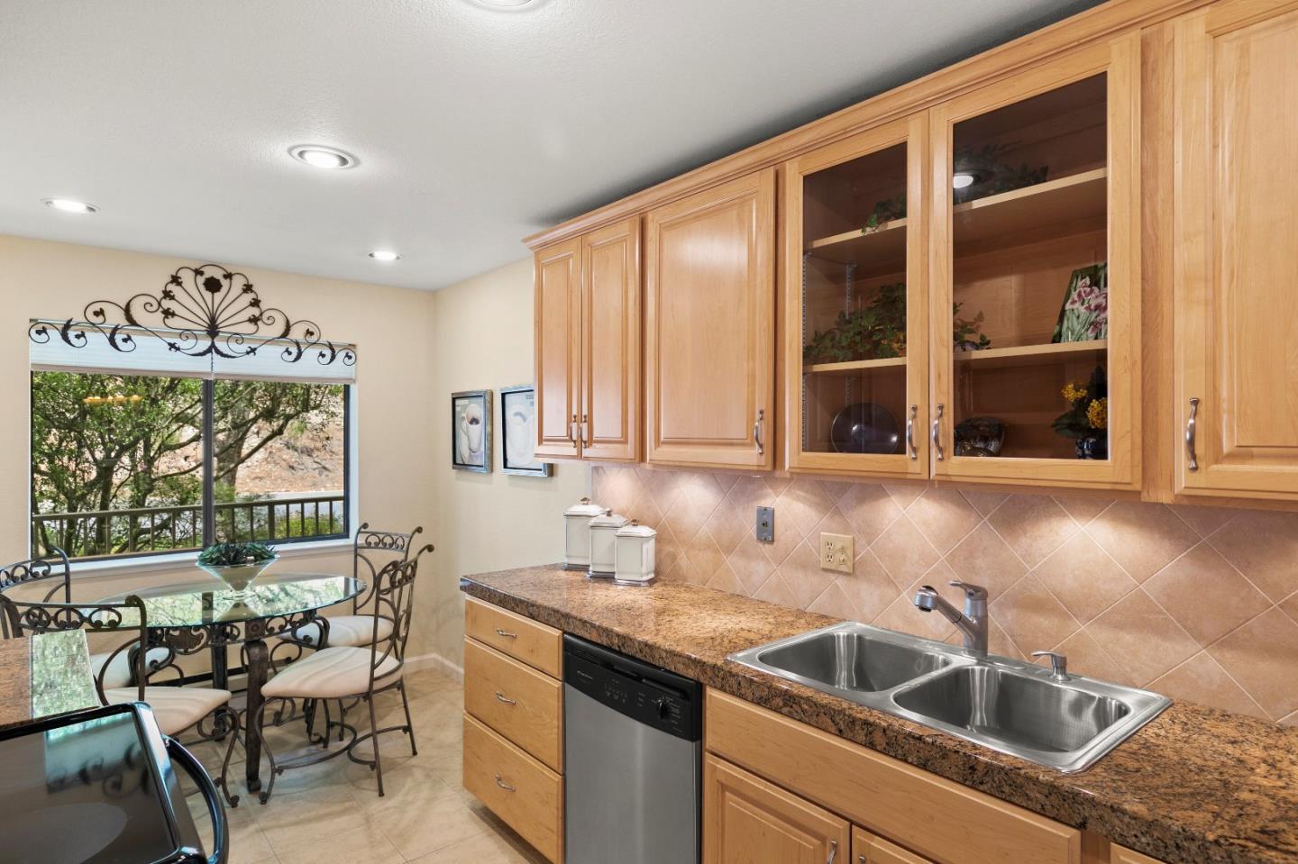 51 Shepherds Knoll Road, Unit 51 Monterey, CA 93940 - Photo 11 of 18 a kitchen that has a sink and a table in it