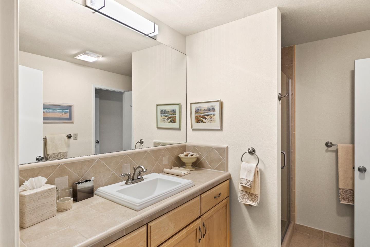 51 Shepherds Knoll Road, Unit 51 Monterey, CA 93940 - Photo 13 of 18 a bathroom with a sink and a mirror