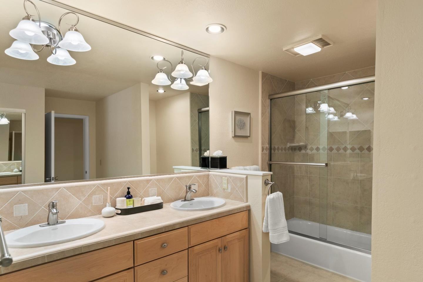 51 Shepherds Knoll Road, Unit 51 Monterey, CA 93940 - Photo 17 of 18 a bathroom with a sink vanity granite tub and shower